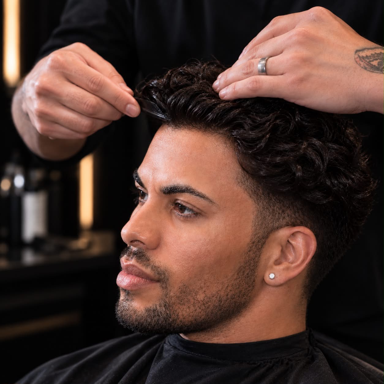 Professional fitting and styling of a client's hair system